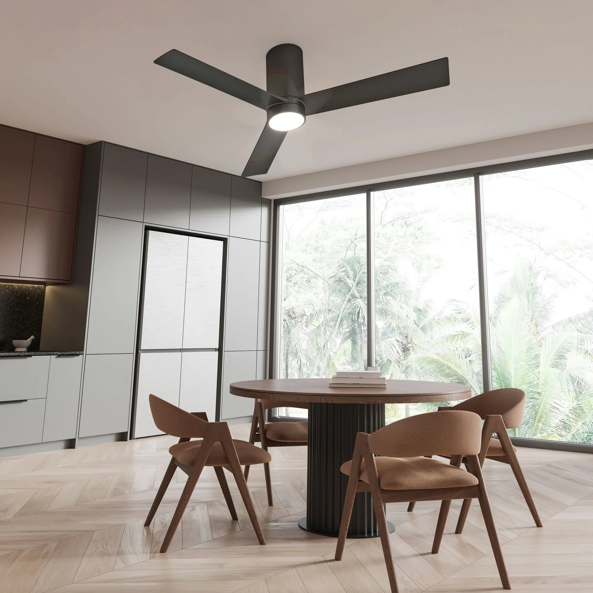 Black Nouvo³ Smart Flush Mount Ceiling Fan installed in a modern dining kitchen with natural lighting, neutral cabinetry, and wood accents.