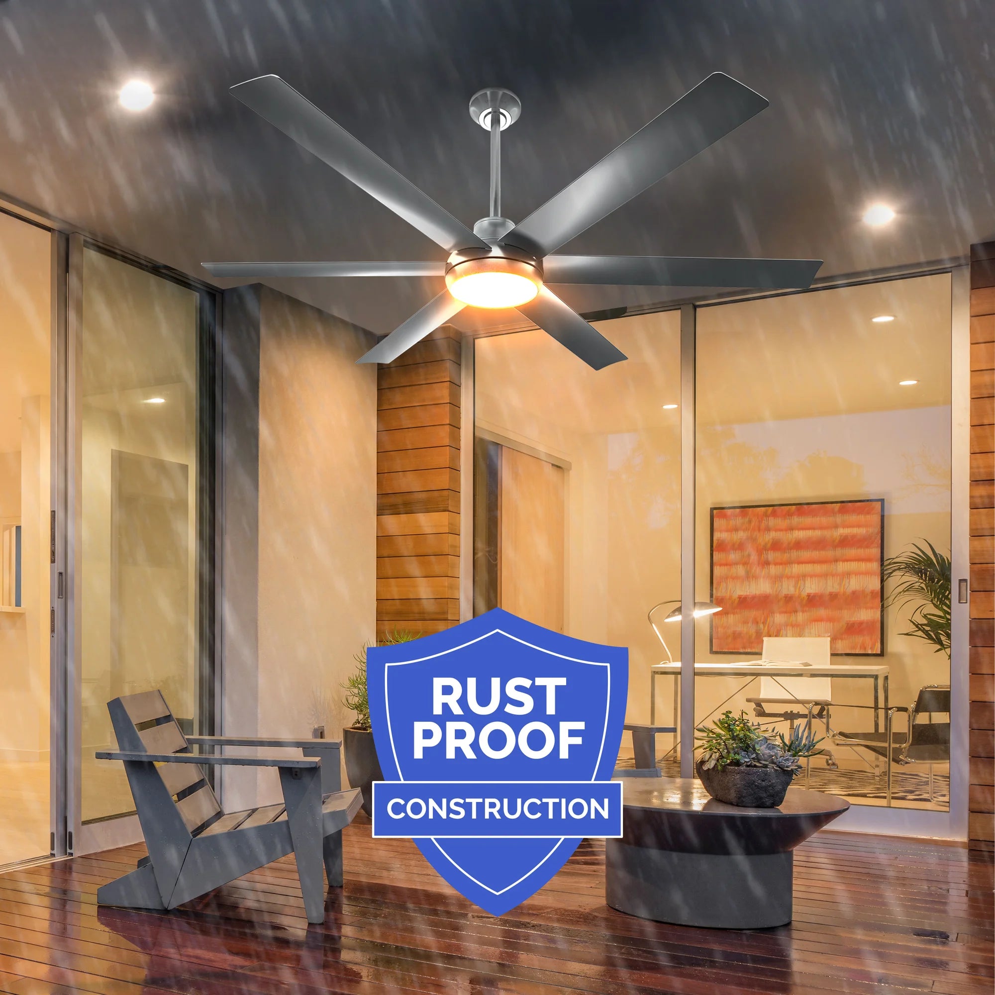 Bresio Ceiling Fan running in heavy rain under a covered patio, highlighting rust-proof construction with an IPX5 rating; includes a blue badge that reads "Rust Proof Construction."