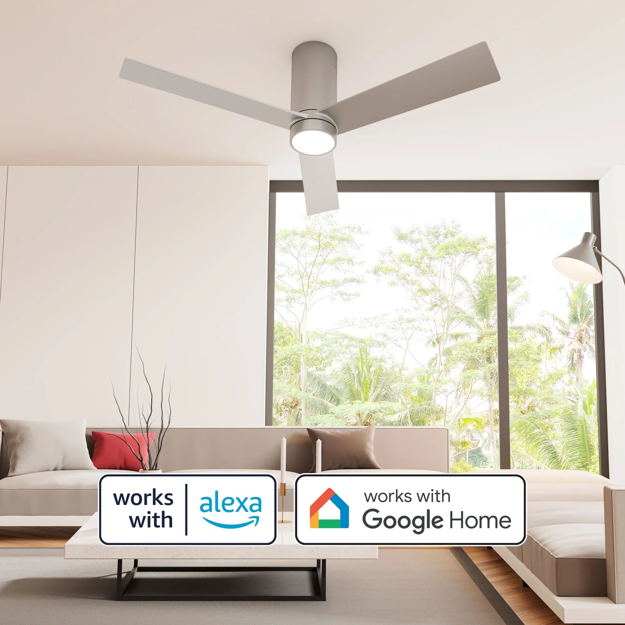 A bright living room with a minimalist aesthetic showcases the Nouvo³ Smart Flush Mount Ceiling Fan. Badges for Alexa and Google Home emphasize the fan’s compatibility with voice-controlled smart home systems.